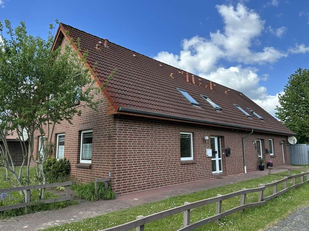 Immobilie in Ostrhauderfehn - Großzügige Haushälfte mit ca. 124 m² Wohnfläche und Garten in ruhiger Lage - Bild 0