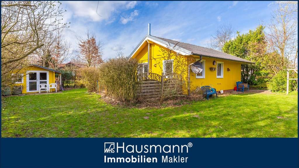 Immobilie in Nehms - Charmantes Ferienhaus mit Kamin und großem Garten unmittelbar am Nehmser See! - Bild 0