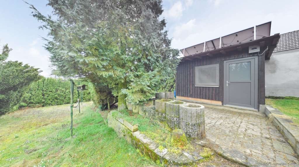 Immobilie in Höpfingen - Viel Platz für Ihre Wohnträume in Höpfingen: Zweifamilienhaus mit großem Garten und Nebengebäude - Bild 3