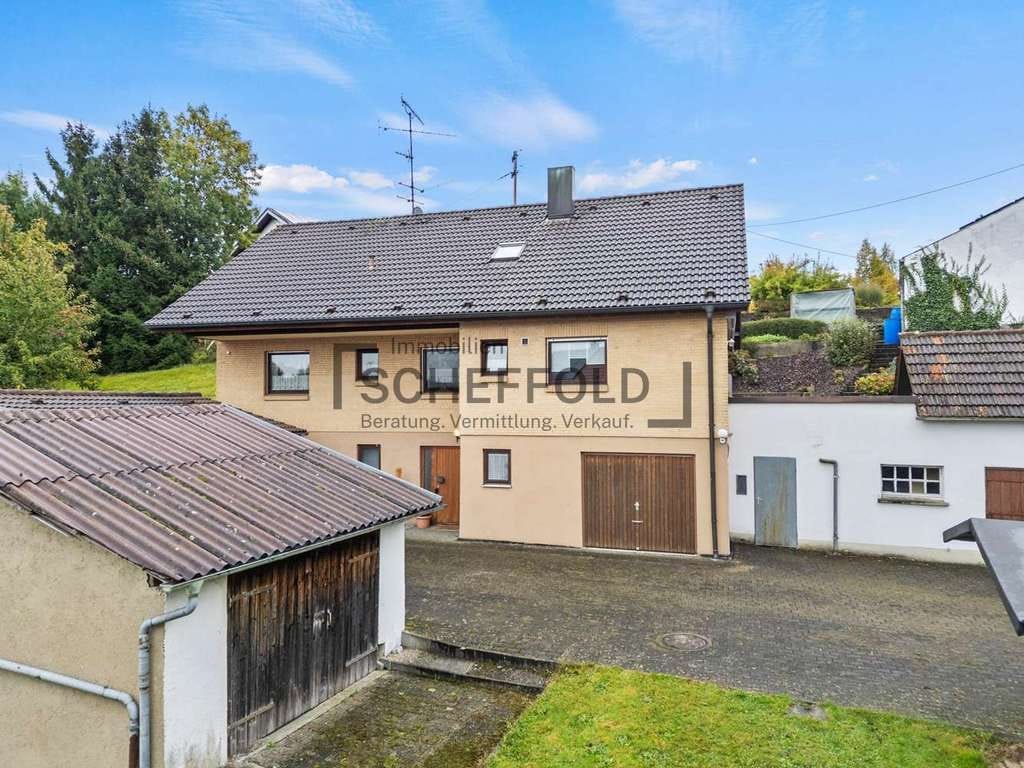 Immobilie in Schwendi - Familienfreundlich! Vielseitiges Einfamilienhaus mit modernisierter Küche und eigener Gartenidylle - Bild 4
