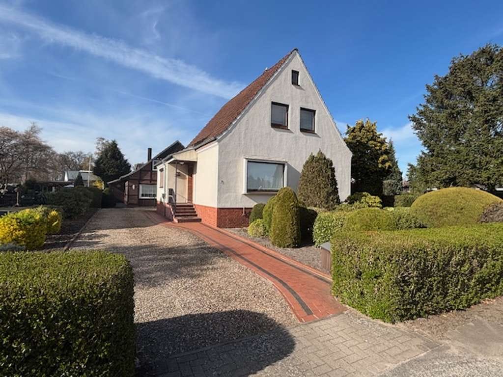 Immobilie in Grasberg - Einfamilienhaus mit zusätzlichem Nebengebäude und großzügigem Garten in zentraler Lage von Grasberg - Bild 1