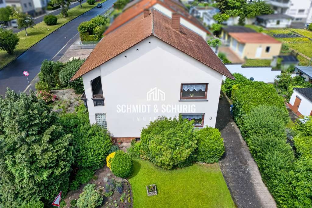 Immobilie in Karlsdorf-Neuthard - Charmantes Zweifamilienhaus mit viel Potenzial und großem Grundstück - Bild 2
