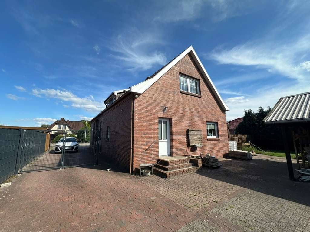 Immobilie in Ostrhauderfehn - Gepflegtes Einfamilienhaus mit großem Garten – viel Platz für die ganze Familie - Bild 1