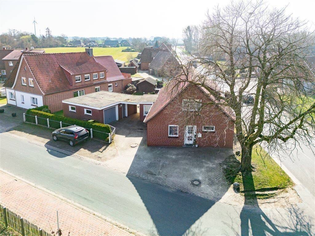Immobilie in Twistringen - Charmantes Einfamilienhaus in guter Lage, mit Garage und Garten -- Platz zum Leben und zum Wohlfühlen für die ganze Familie! - Bild 1