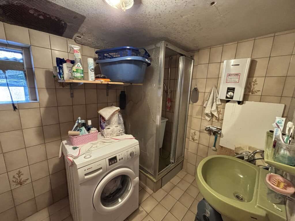 Immobilie in Aachen - Kleines, sanierungsbedürftiges Einfamilienhaus auf schönem Grundstück - Bild 1
