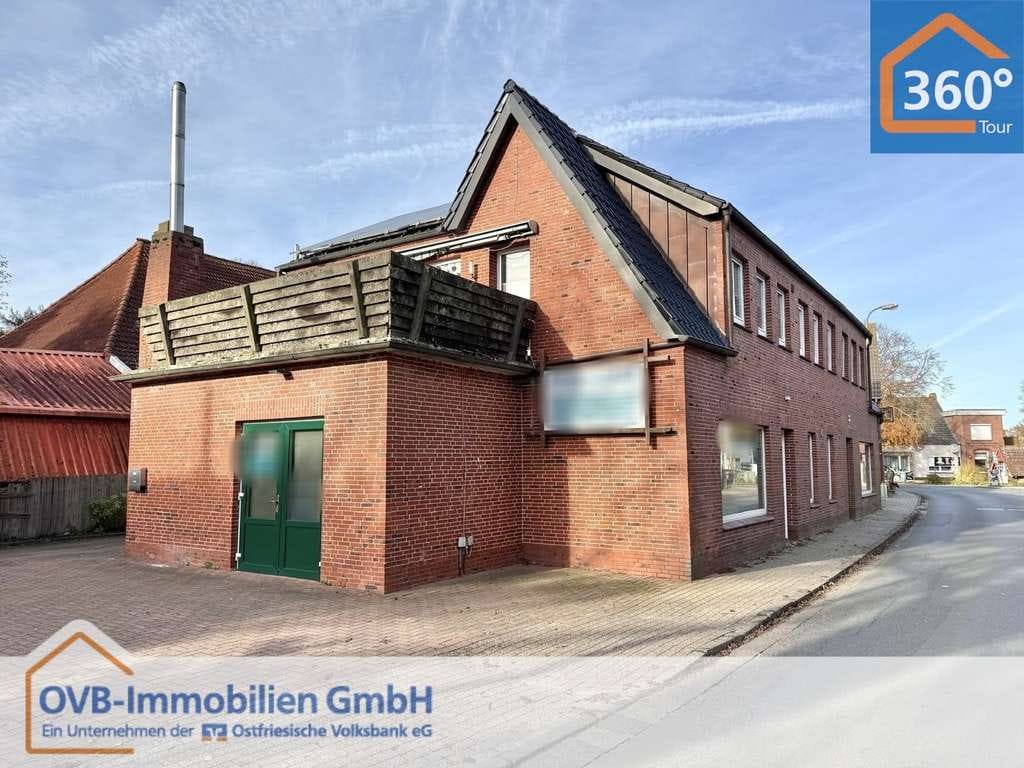 Immobilie in Krummhörn - Wohn- und Geschäftshaus mit vielseitigen Nutzungsmöglichkeiten in bester Sichtlage von Pewsum

 - Bild 0