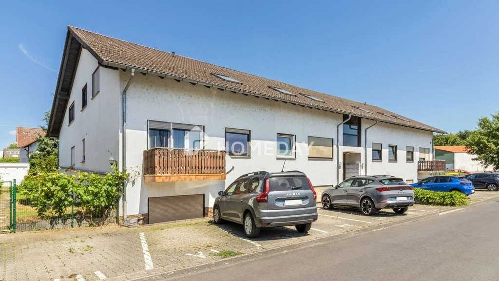 Immobilie in Lich - Gepflegte Drei-Zimmer-Erdgeschosswohnung mit zwei Stellplätzen und idyllischem Gemeinschaftsgarten - Bild 0