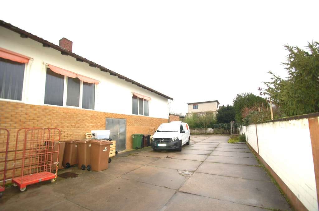 Immobilie in Bürstadt - Mehrfamilienhaus mit Ladengeschäft in ruhiger und beliebter Lage - Bild 1