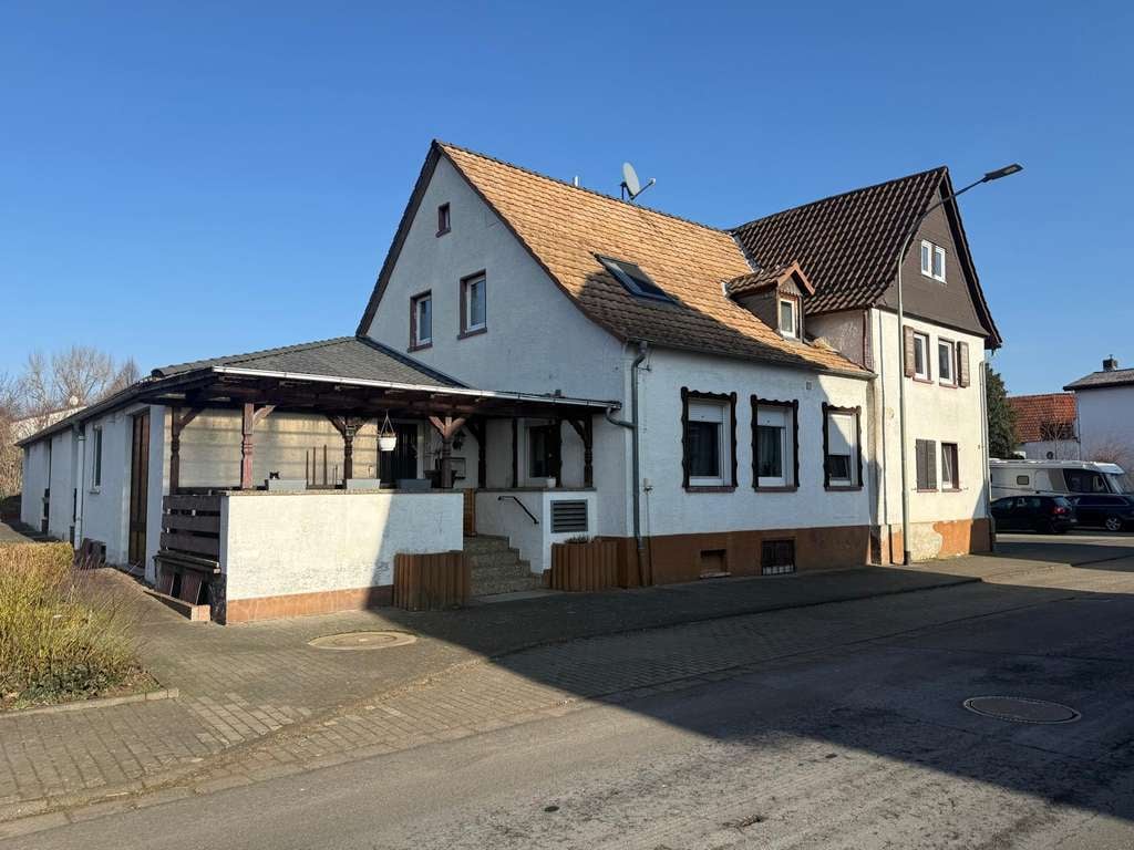 Immobilie in Hungen - Mehrfamilienhaus mit 7 Einheiten und Baugrundstück - Bild 0