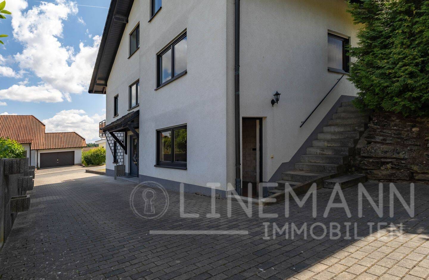 Immobilie in Hardheim - Ihr grüner Wohntraum: Saniertes 3-Familienhaus – Perfekt für Eigennutzer, Investoren und Familien - Bild 2