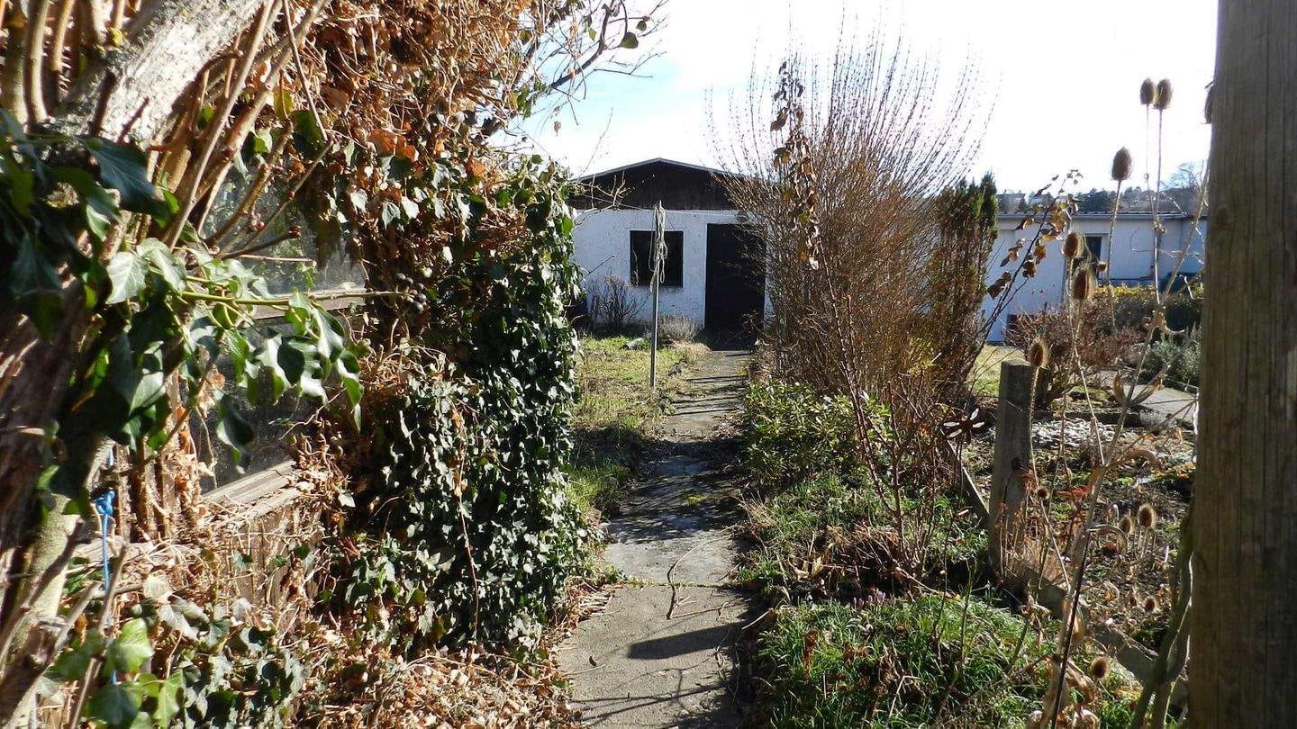 Immobilie in Unterwellenborn - Reihenmittelhaus mit Garage und Nebengelass zu verkaufen - Bild 2