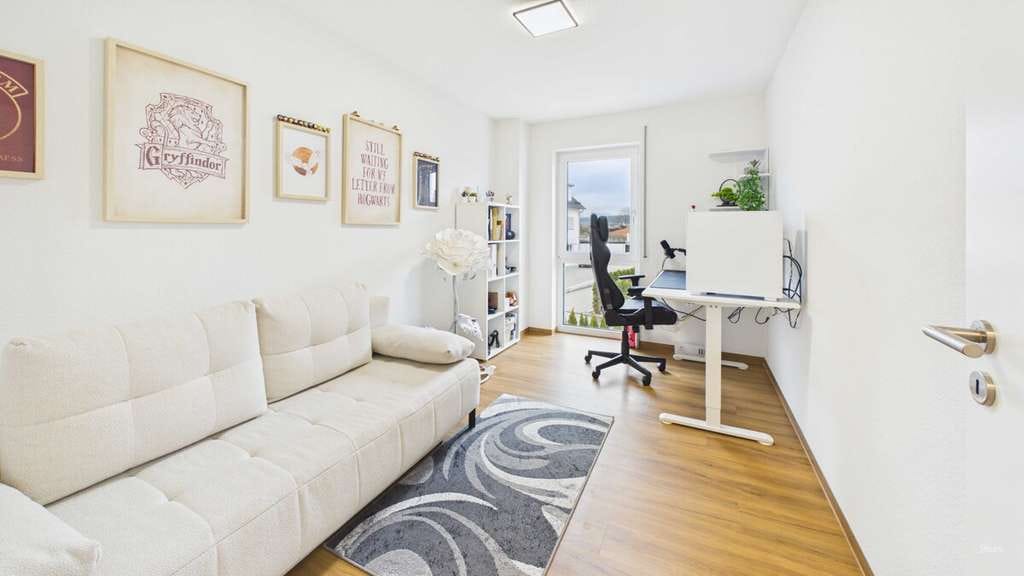 Immobilie in Langenenslingen - moderne barrierefreie A+ Wohnung - ruhige Lage mit großem Balkon, EBK & große Garage - Bild 4
