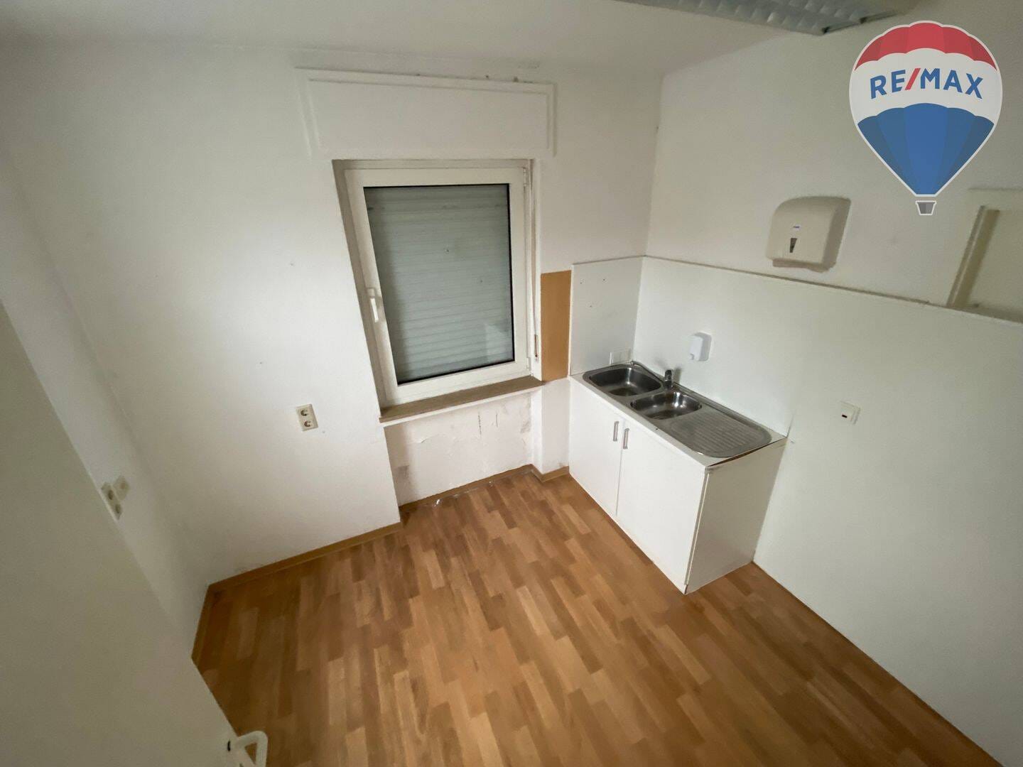 Immobilie in Holzappel - Mehrfamilienhaus mit Ladengeschäft und Halle - Bild 4