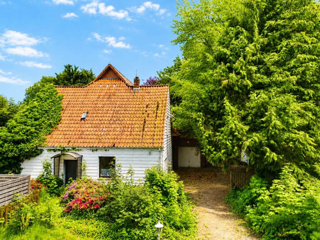 Immobilie in Wardenburg - Sanierungsbedürftiges Wohnhaus mit viel Potenzial auf großzügigem Naturgrundstück! - Bild 0
