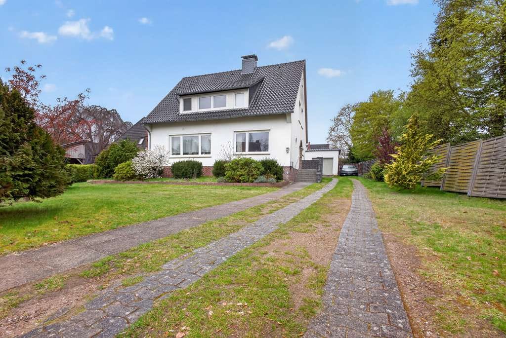 Immobilie in Bruchhausen-Vilsen - Bruchhausen-Vilsen | Vielseitiges Einfamilienhaus in zentraler Lage mit Garten und Garage - Bild 1