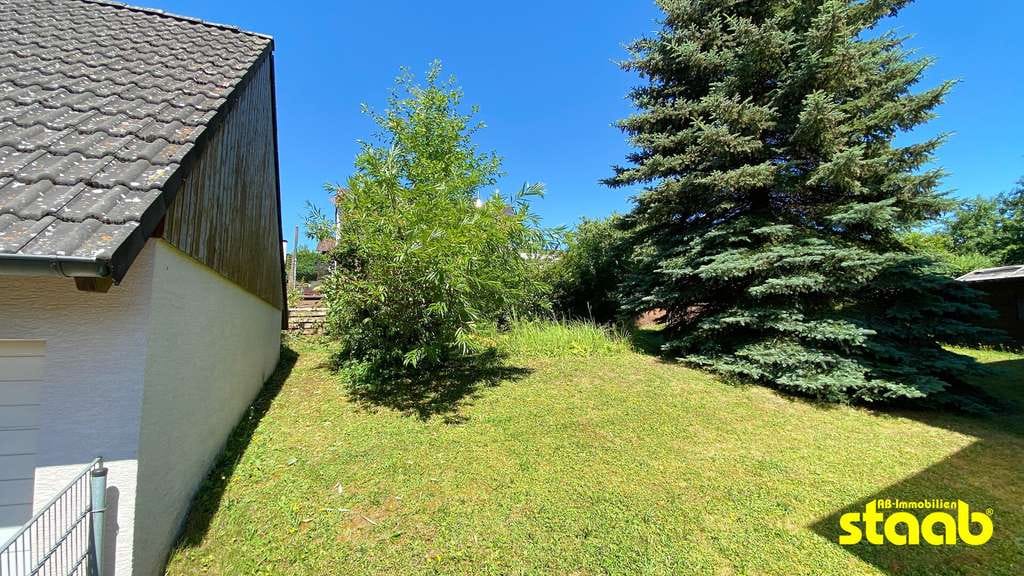 Immobilie in Eschau - POTENZIAL STATT PERFEKTION – VERMIETETES ZWEIFAMILIENHAUS ZUR SANIERUNG MIT HERRLICHEM WEITBLICK - Bild 1