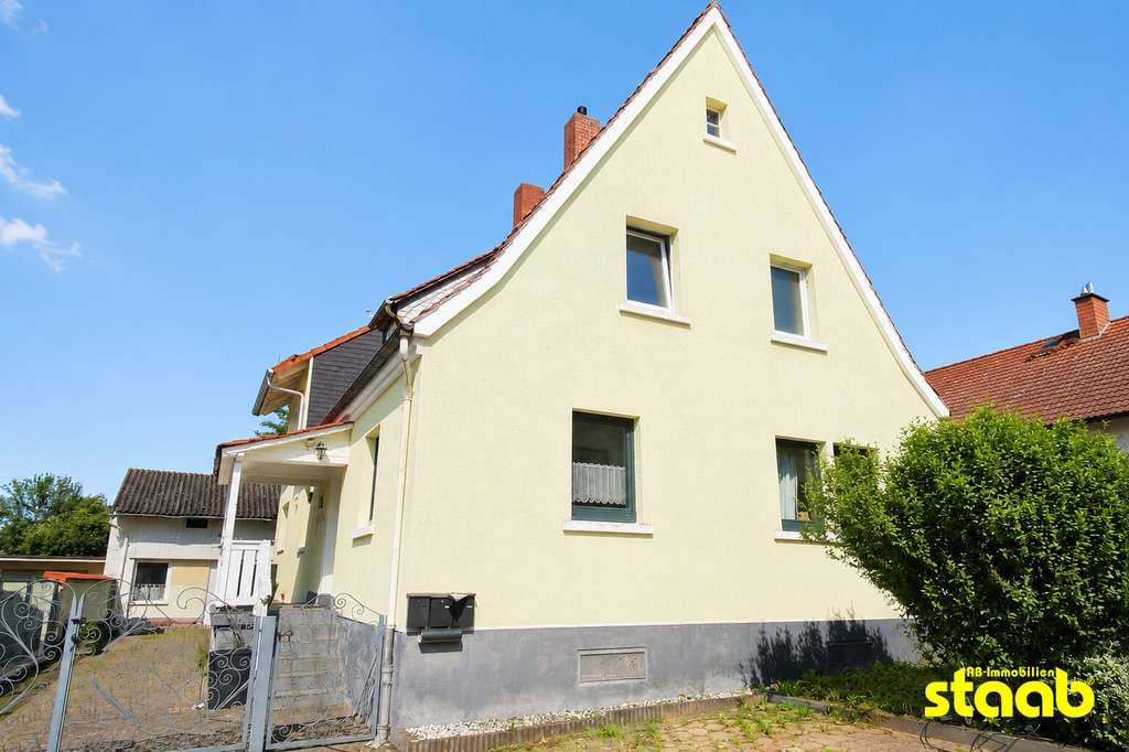 Immobilie in Sulzbach am Main - Wohnen mit Perspektive – Siedlungshaus mit Nebengebäude und Grundstück - Bild 1
