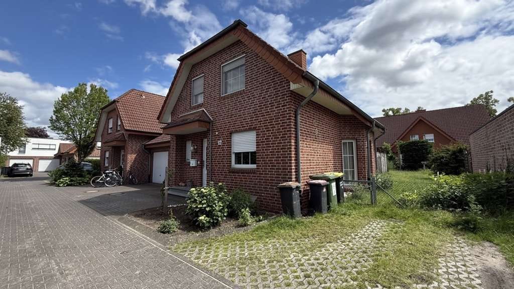 Immobilie in Rheda-Wiedenbrück - Doppelhaushälfte mit Potenzial und individuellem Gestaltungsspielraum auf Erbpachrgrundstück in Wied - Bild 1