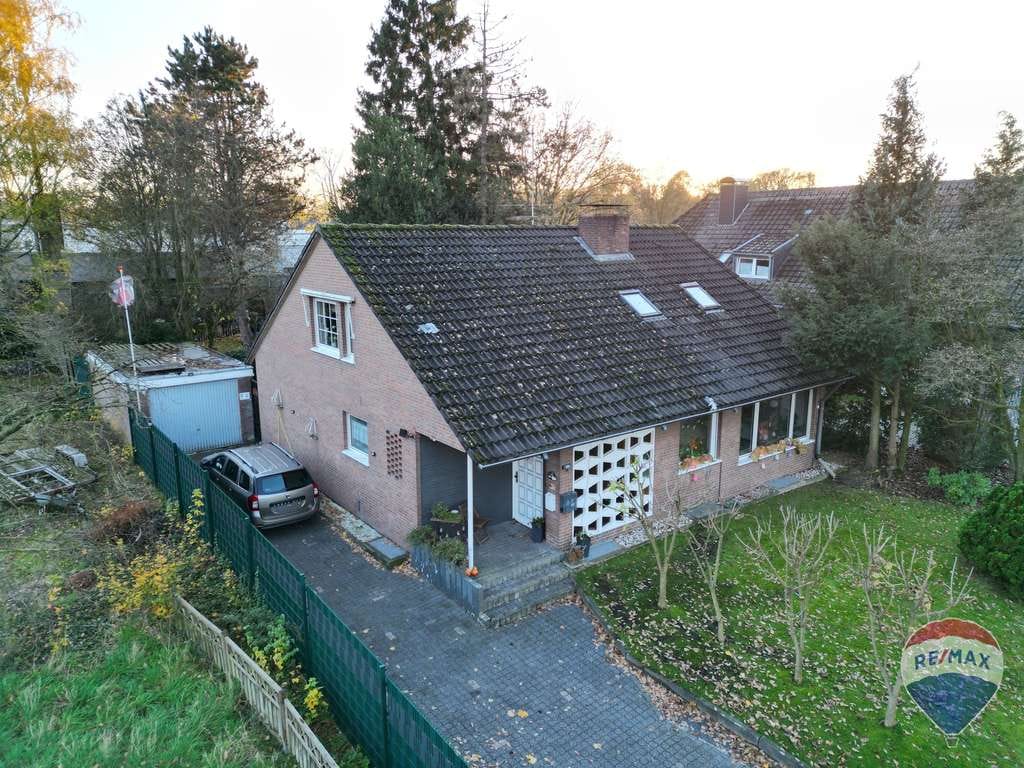 Immobilie in Bedburg-Hau - Zweifamilienhaus mit Wintergarten und vielseitigen Nutzungsmöglichkeiten auf tollem Grund ! - Bild 2