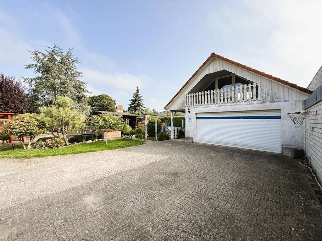 Immobilie in Wusterhausen/Dosse - Charmantes Einfamilienhaus mit großem Garten und Doppelgarage – für Kapitalanleger in Bantikow - Bild 1