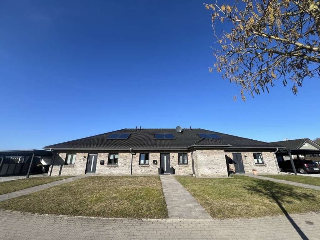 Immobilie in Süderbrarup - Neubaugleiches Reihenmittelhaus in ruhiger, zentraler Lage (aktuell vermietet) - Bild 1