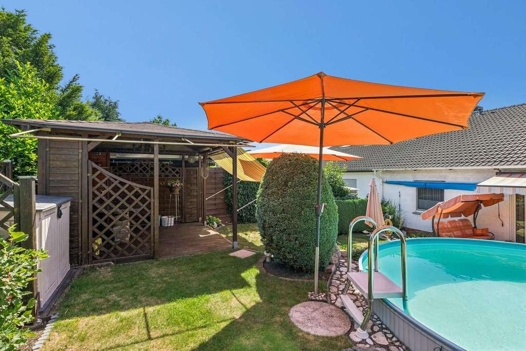 Immobilie in Pohlheim - Gepflegte Doppelhaushälfte in ruhiger Feldrandlage mit Pool und Garten - Bild 4