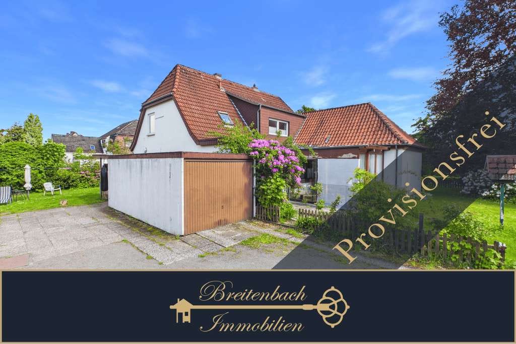 Immobilie in Achim - Achim - Uesen • Großzügiges Zweifamilienhaus mit 4 Garagen & Wintergarten - Bild 0