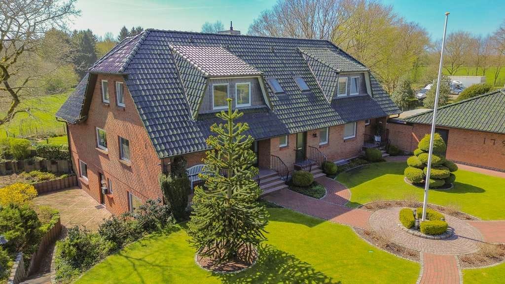 Immobilie in Oeversee - Großzügiges Mehrfamilienhaus mit drei Wohneinheiten und unverbaubarem Naturblick - Bild 1