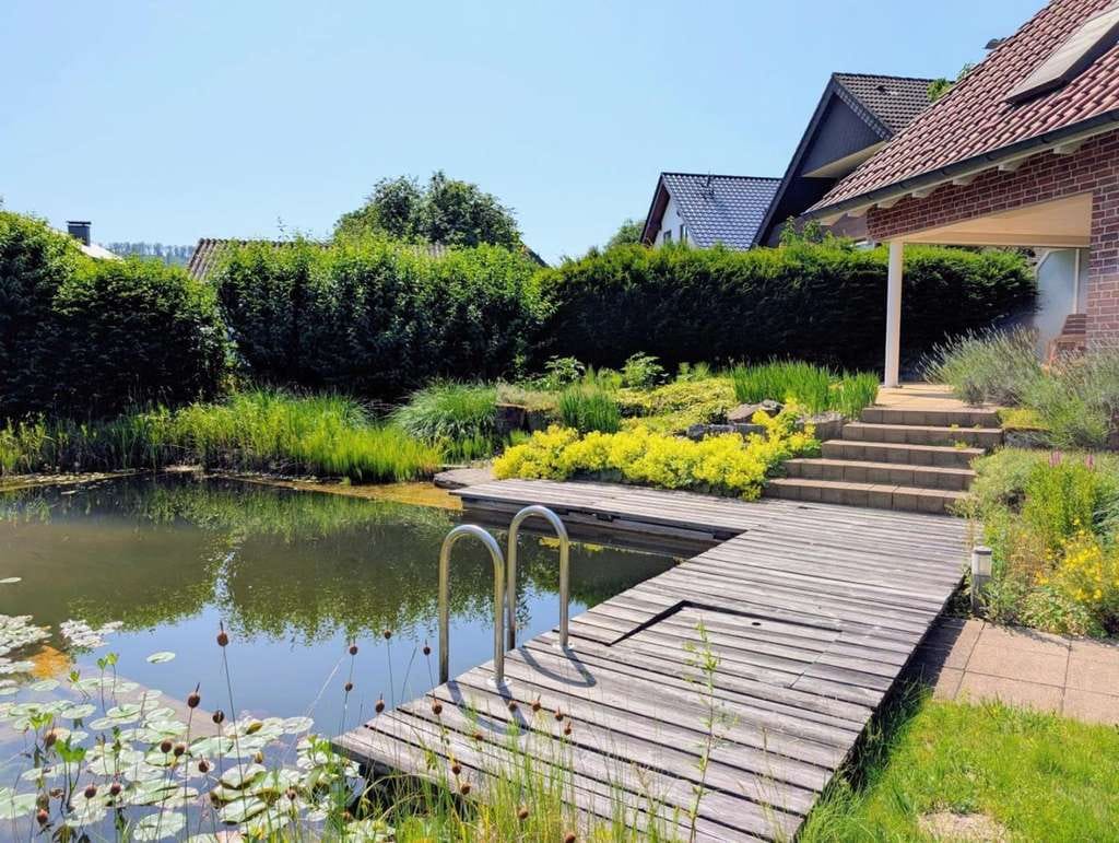 Immobilie in Werther - Architektenhaus mit Naturschwimmteich und hochwertiger Einliegerwohnung  - Bild 1
