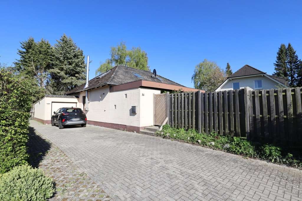 Immobilie in Sievershütten - Vermietetes Einfamilienhaus auf attraktivem Grundstück in Sievershütten - Bild 1
