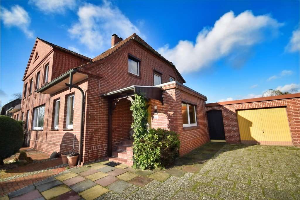 Immobilie in Diepholz -  Doppelhaushälfte im Stadtzentrum von Diepholz
 Backsteinbau mit schönem Garten - Bild 1