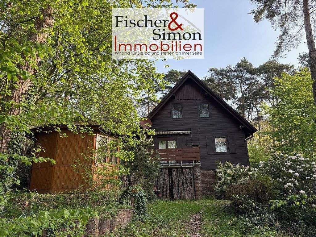 Immobilie in Steyerberg - Steyerberg- charmantes Holzhaus mit massivem Vollkeller in naturnaher, ruhiger Hanglage - Bild 2