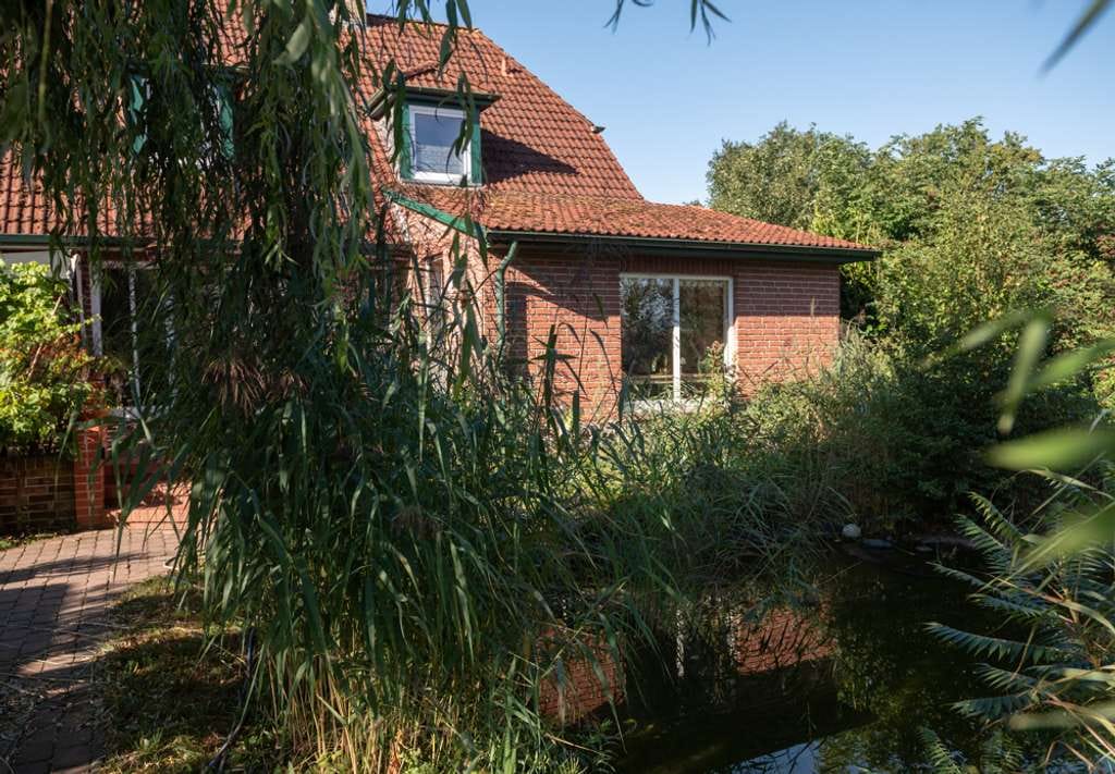 Immobilie in Grasberg - Einfamilienhaus mit Einliegerwohnung 
in idyllischer Lage - Bild 1