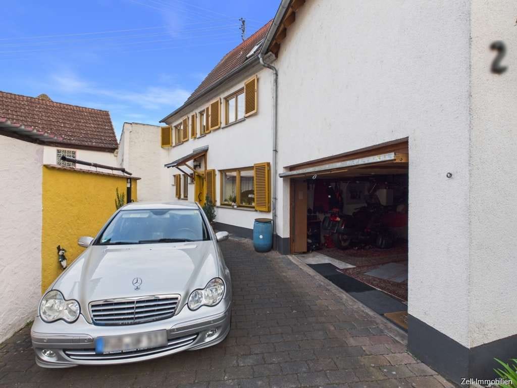 Immobilie in Oestrich-Winkel - Tolles Einfamilienhaus mit separater Wohnung im Anbau und Garage in zentraler Lage von Oestrich - Bild 3