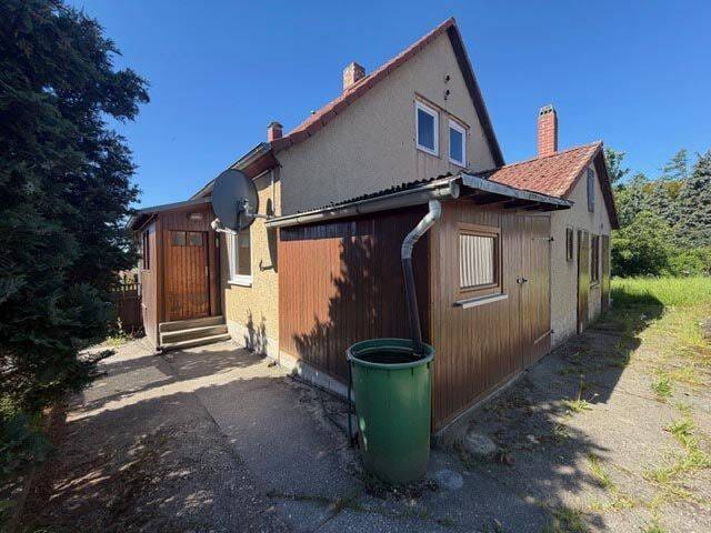 Immobilie in Eisenberg - Doppelhaushälfte mit Garage und Garten - Bild 1