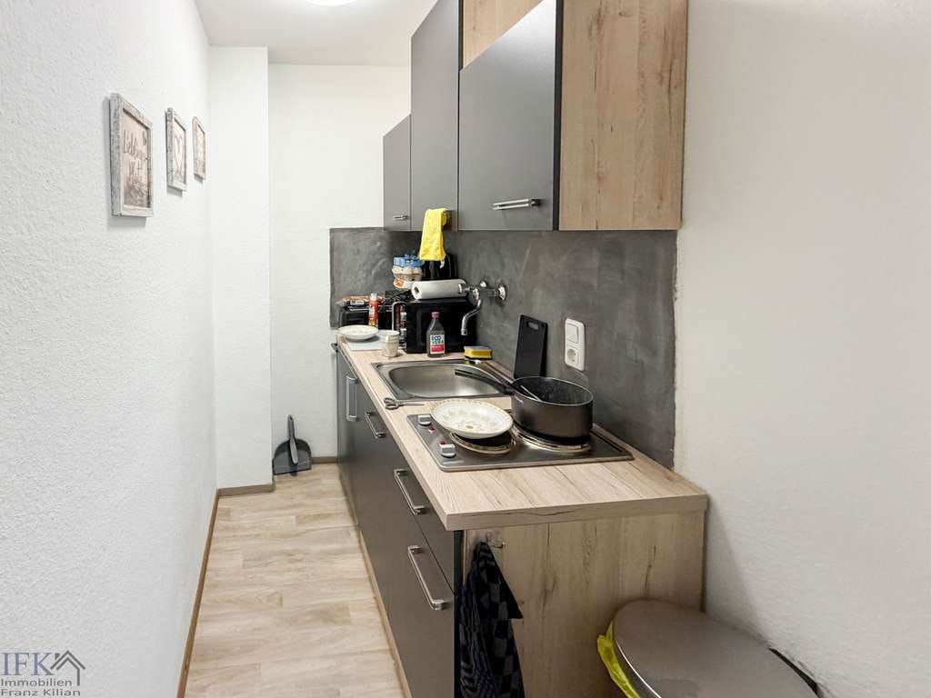 Immobilie in Weilheim in Oberbayern - Kleine Wohnung, großes Potenzial – vermietetes Appartement mit Balkon in Weilheim - Bild 1
