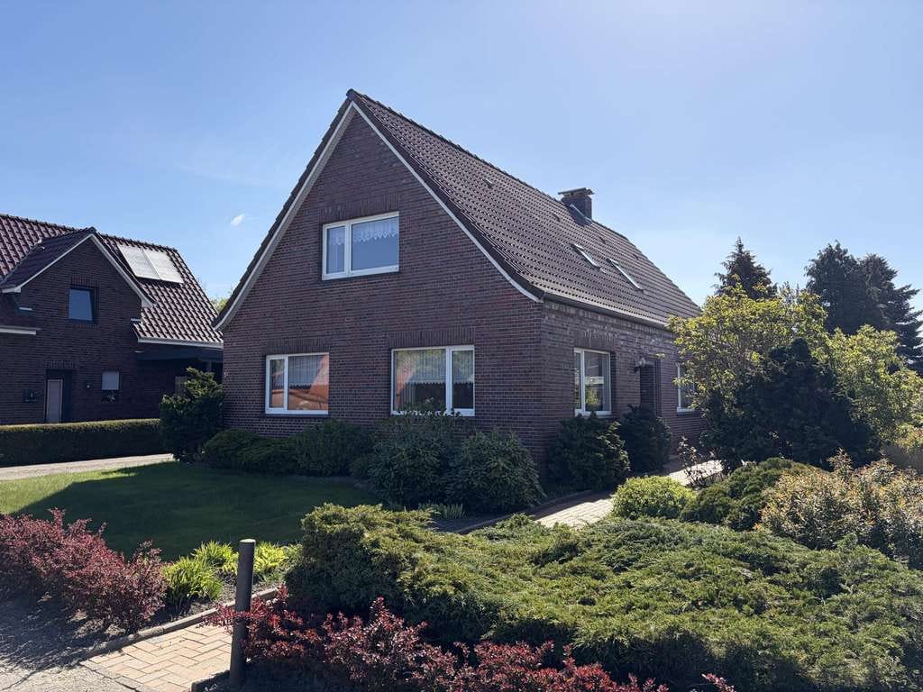 Immobilie in Großefehn - Solides Einfamilienhaus mit großzügigem Garten in Spetzerfehn - Bild 1