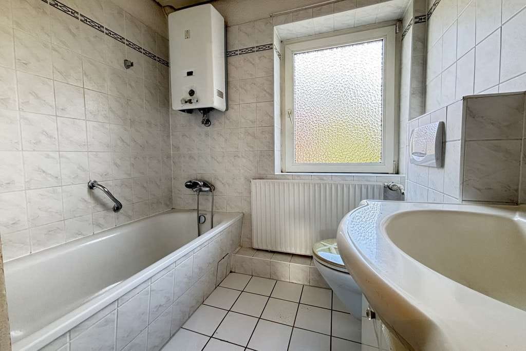Immobilie in Bad Schwartau - Charmantes Mittelreihenhaus mit Potential in ruhiger Wohnlage - Bild 3