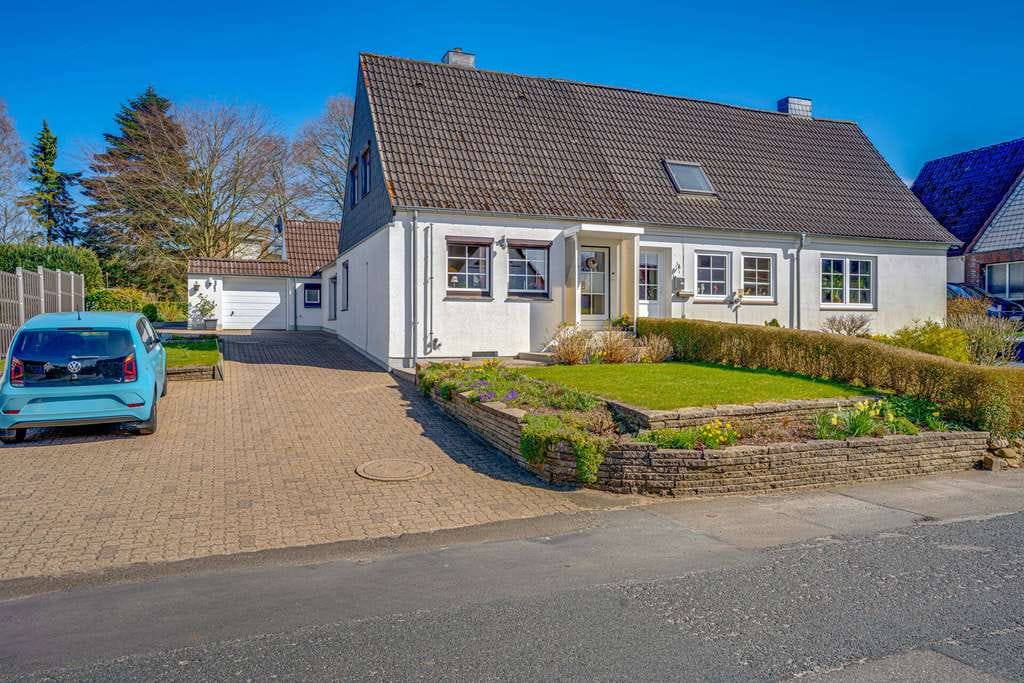 Immobilie in Schleswig - Gepflegtes REH auf außergewöhnlich großem Grundstück mit Terrasse, Garage & vielen Möglichkeiten! - Bild 1