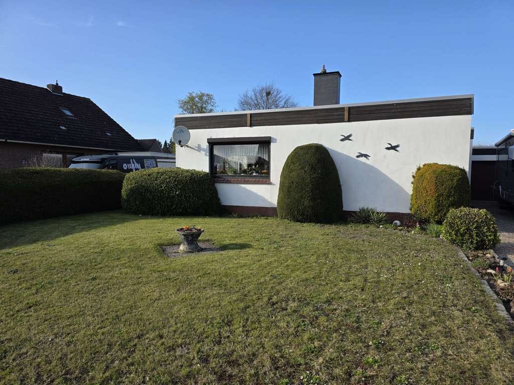 Immobilie in Weener - Solides Flachdachhaus mit Gartenidylle in angenehmer Wohnlage - Bild 2