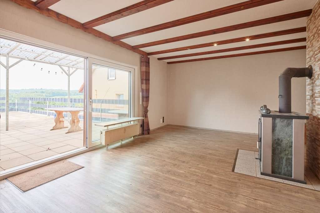 Immobilie in Büdingen - Nachhaltiges Familienidyll mit Einliegerwohnung und Weitblick - Bild 4