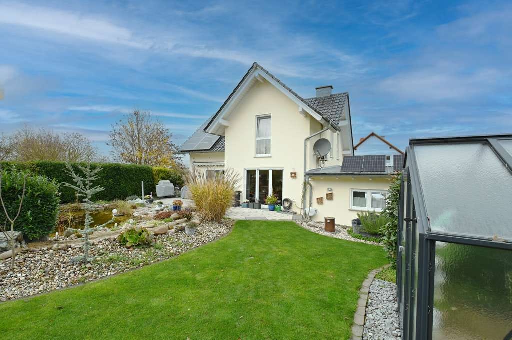 Immobilie in Hahnheim - Naturnahes Familienhaus mit ELW, gepflegtem  Garten mit Teichanlage u. Doppelgarage für Ihr Familien - Bild 4