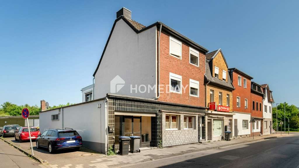 Immobilie in Alsdorf - Solides Mehrfamilienhaus mit freier Gewerbefläche, Terrasse, Balkon und Stellplätzen in Alsdorf - Bild 1