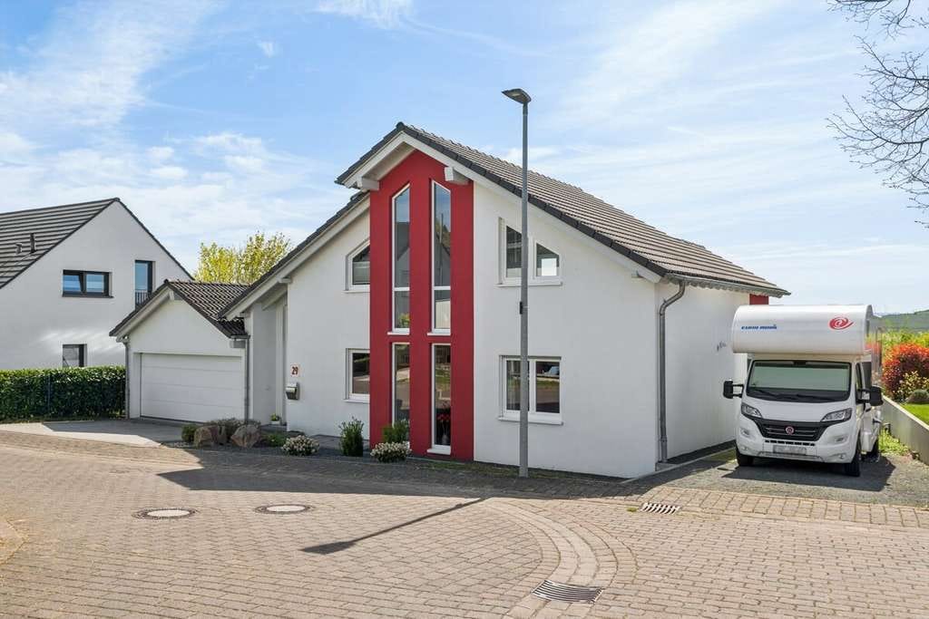 Immobilie in Wolfsheim - Provisionsfrei – Modernes Haus mit traumhaftem Weitblick und sonniger Terrasse in Ortsrandlage - Bild 1