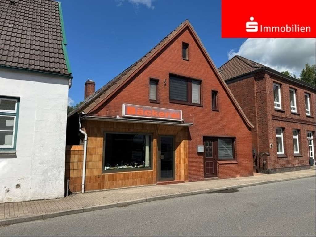 Immobilie in Wewelsfleth - Haus mit Ladengeschäft und Wohnung in Dorflage - Bild 0