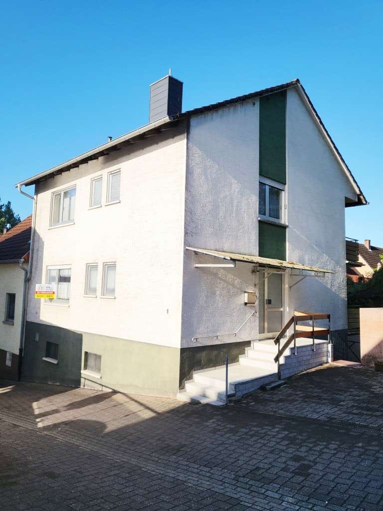 Immobilie in Contwig - Ein- bis Zweifamilienhaus mit großem Potenzial und sonnigem Garten - Bild 1