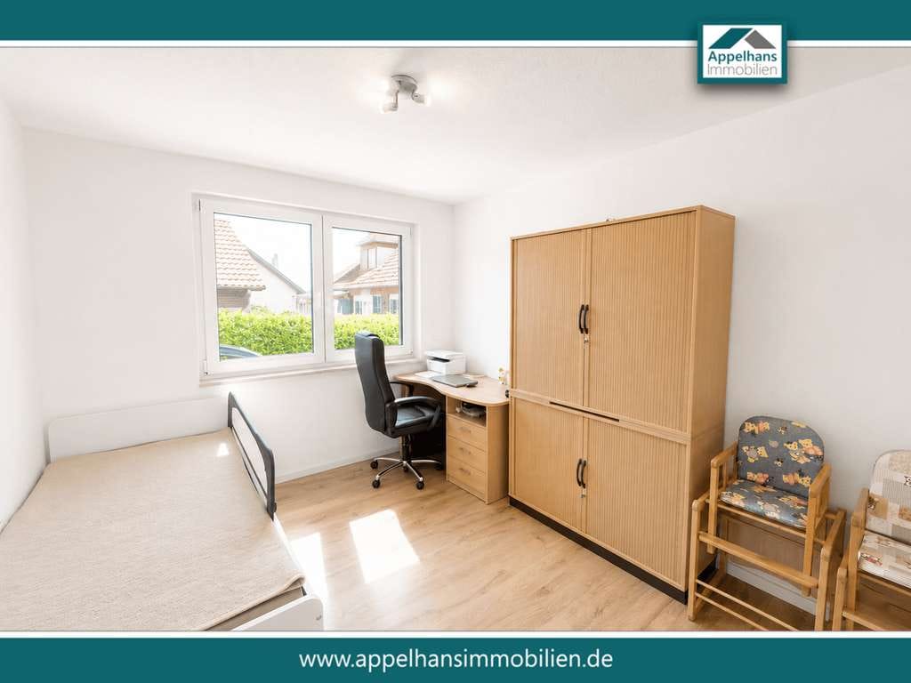 Immobilie in Bippen - Modernisiertes Zweifamilienhaus mit zwei Wohneinheiten, Wintergarten, Kamin und großzügigem Garten - Bild 4