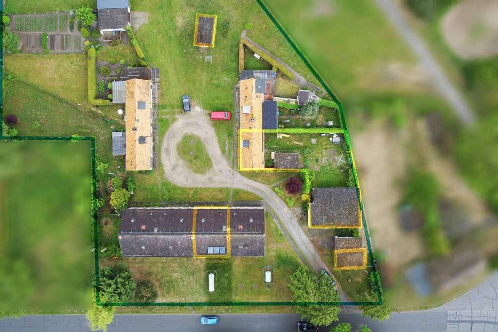 Immobilie in Süderholz - Attraktives Anlagepaket mit Eigennutzoption: 2x 3-Zimmer-Wohnungen + Garagen, Garten & Bungalow  - Bild 1