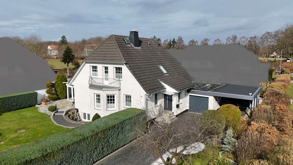 Immobilie in Rickling - Exklusives Einfamilienhaus mit hochwertiger Ausstattung, Sauna, Wintergarten und großem Grundstück - Bild 2