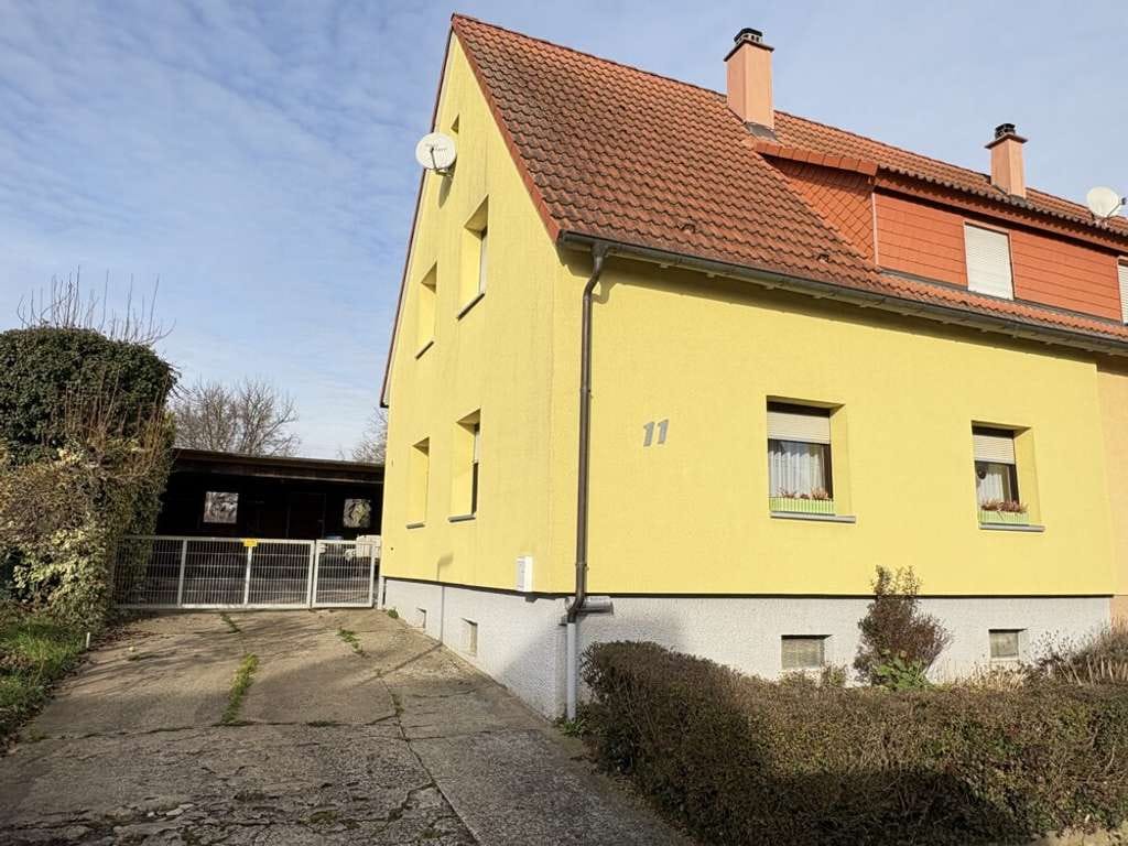 Immobilie in Walzbachtal - Doppelhaushälfte mit Potenzial in ruhiger Lage mit Garten & großem Carport - Bild 0